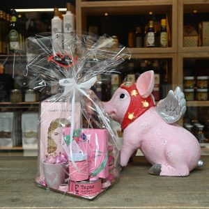 Corbeille cadeau 100% rose avec un cochon aillé lumineux